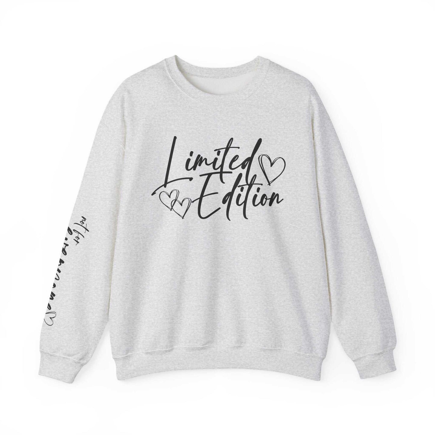 White crewneck sweatshirt with black script "Limited Edition" and hand-drawn hearts on chest and sleeve, cozy and relaxed fit