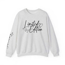 White crewneck sweatshirt with black script "Limited Edition" and hand-drawn hearts on chest and sleeve, cozy and relaxed fit