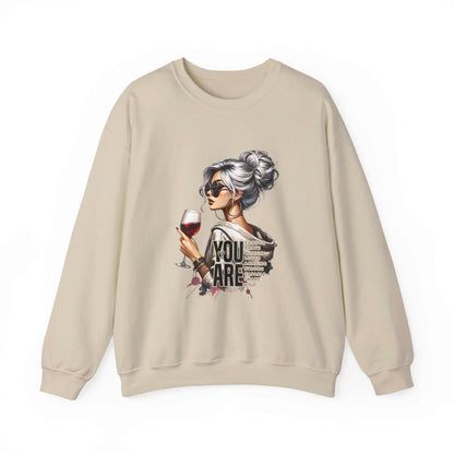 beige crewneck sweatshirt with graphic of chic woman with silver hair and sunglasses holding wine glass with "You Are Loved" text