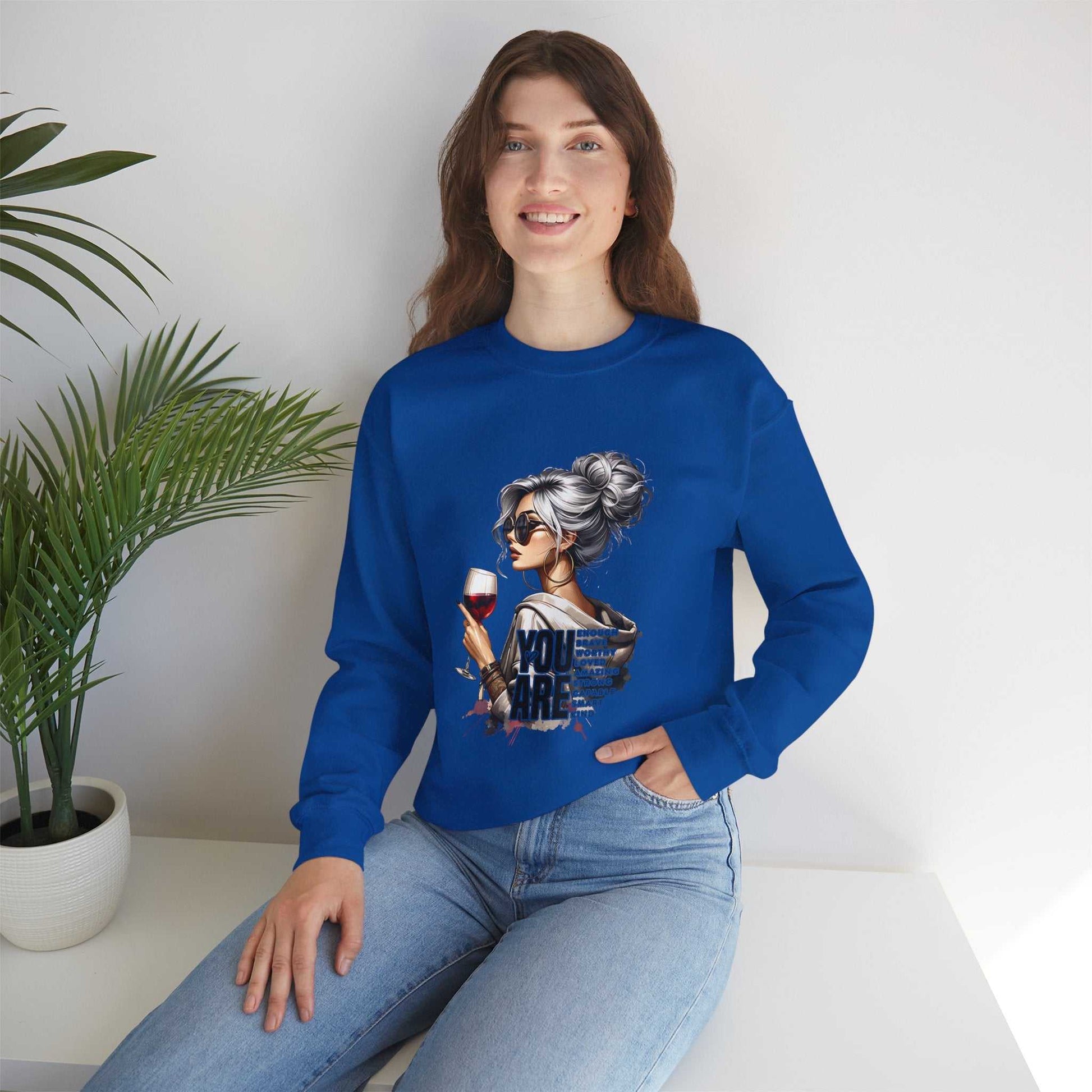 Woman wearing blue Chic Woman with Wine Sweatshirt with silver-haired woman graphic holding wine glass