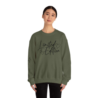 Woman wearing olive green Limited Edition Script Hearts Sweatshirt with black script and heart designs on chest and sleeve