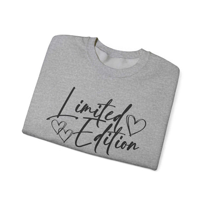 White crewneck sweatshirt with black "Limited Edition" script and hearts design, cozy and relaxed fit