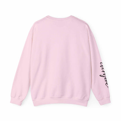 Back view of pink limited edition script hearts sweatshirt with black script on sleeve and ribbed cuffs and hem