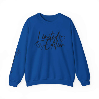 Blue crewneck sweatshirt with "Limited Edition" script and hand-drawn hearts on chest and sleeve