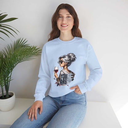 Chic woman with silver hair wearing light blue sweatshirt holding wine glass You Are Loved graphic design
