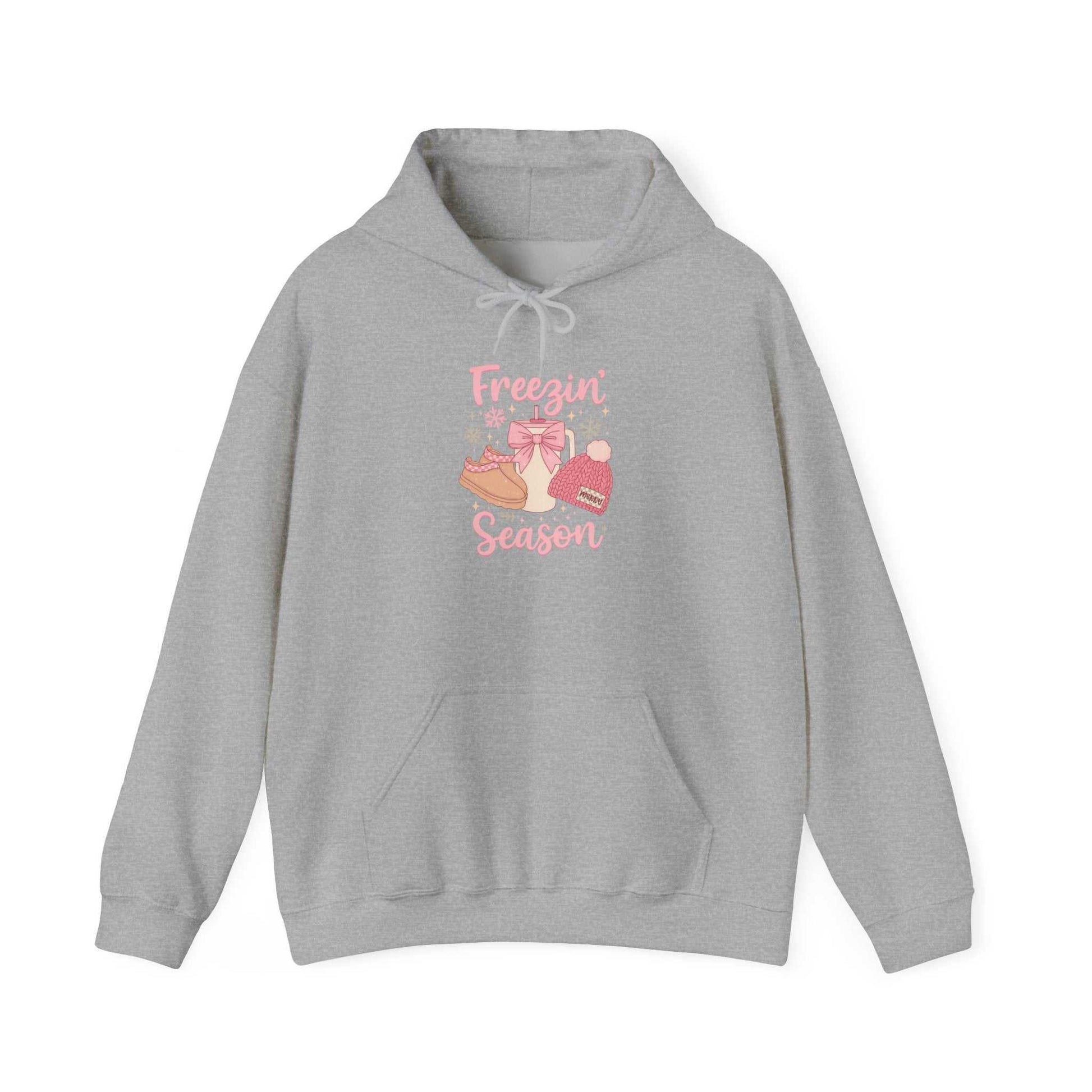 gray hoodie with winter boots, hat, mittens graphic and text "Freezin' Season"
