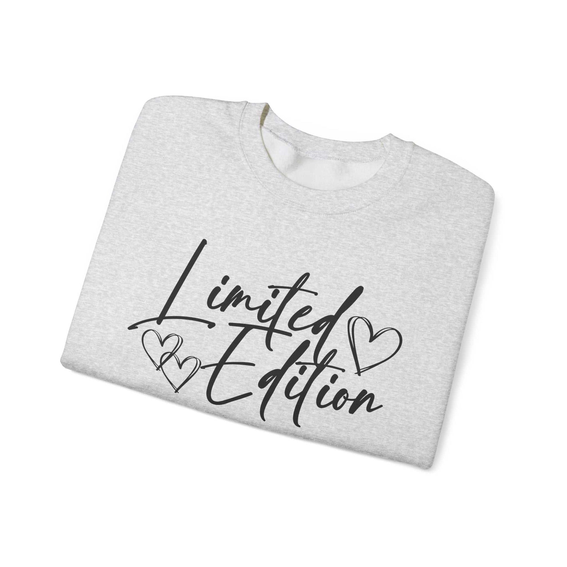 White crewneck sweatshirt with black "Limited Edition" script and hand-drawn hearts on chest, cozy and relaxed fit Limited Edition Script Hearts Sweatshirt