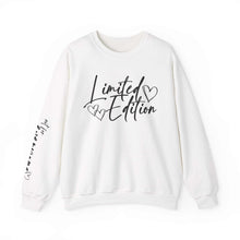 White crewneck sweatshirt with "Limited Edition" script and hand-drawn hearts on chest and sleeve, cozy and relaxed fit