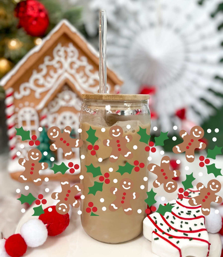 Ginger Bread glass tumbler with acrylic lid and straw, decorated with holiday-themed gingerbread men and holly patterns