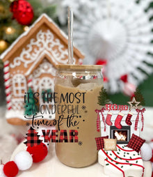 16oz glass tumbler with "It's the Most Wonderful Time of the Year" text, acrylic lid, and straw, festive holiday decor background