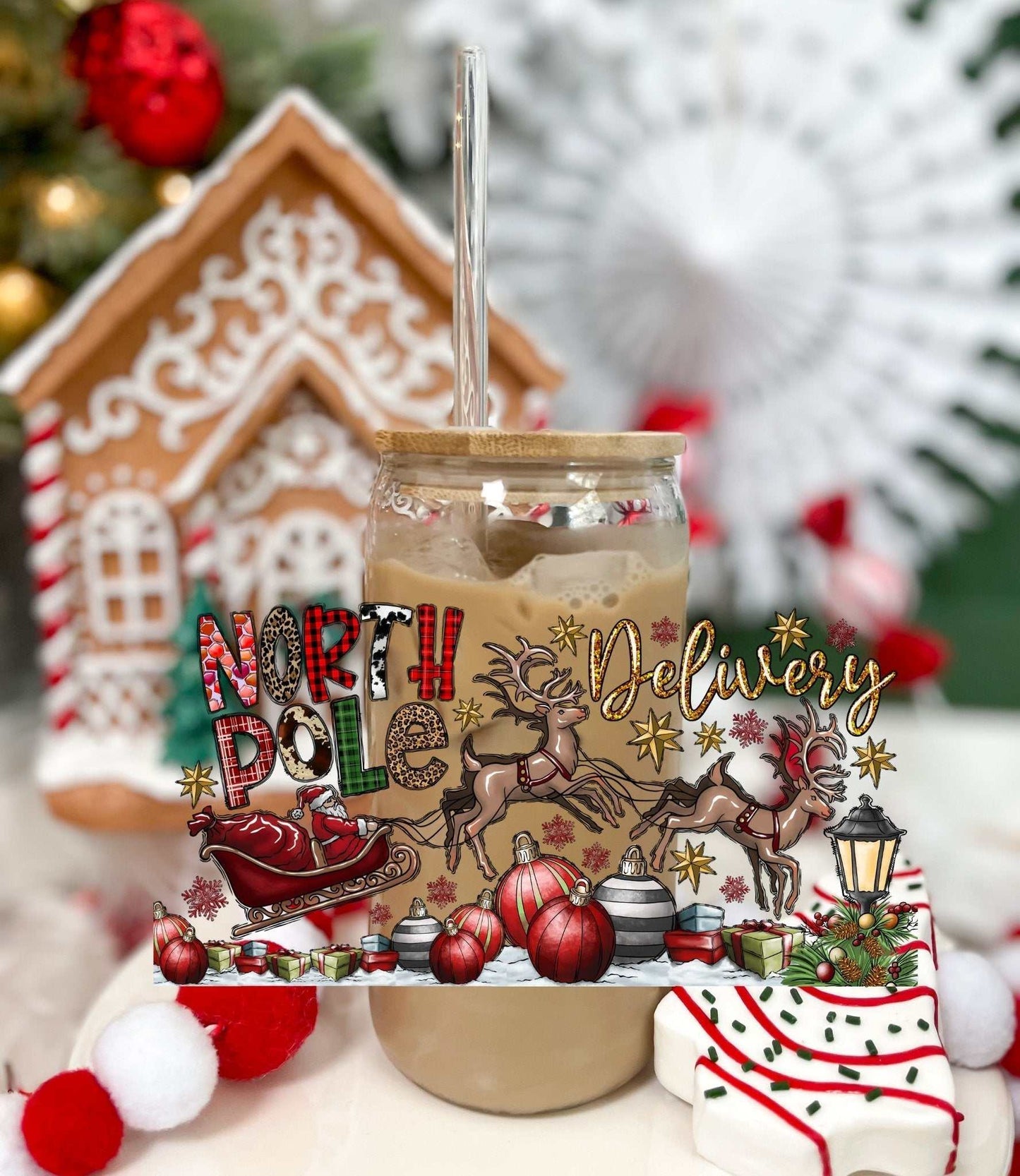 North Pole Delivery 16oz glass with acrylic lid and straw featuring festive holiday design with reindeer and sleigh